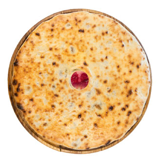 A pie with juice cherries, instant peas and pears